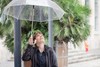 RainDance in Herrenhausen: Eine junge Frau blickt durch ihren durchsichtigen Regenschirm nach oben